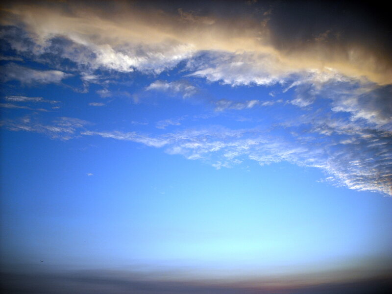 Blue sky with golden clouds