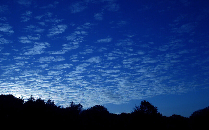Blue sky with scattered clouds