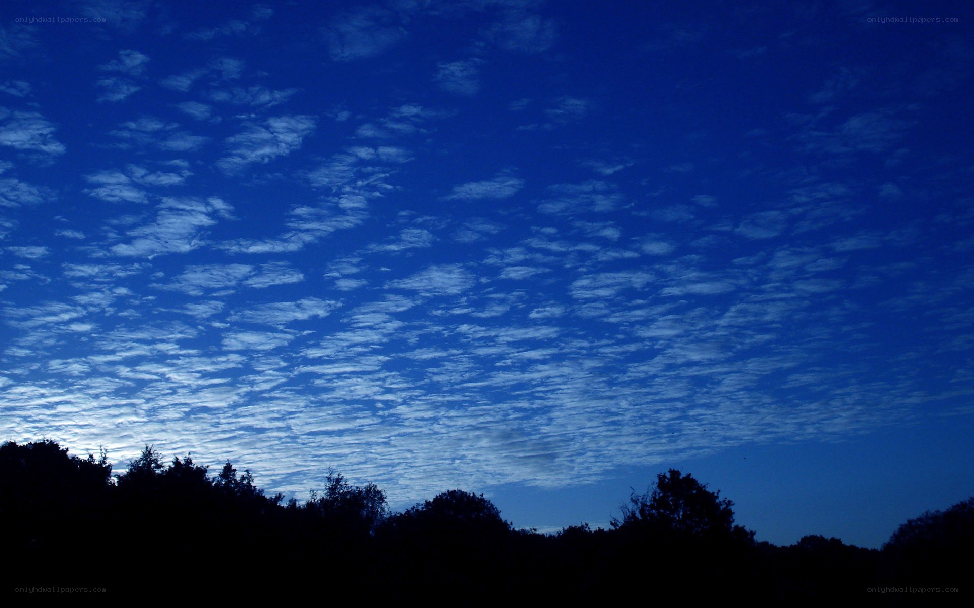 Blue sky with scattered clouds