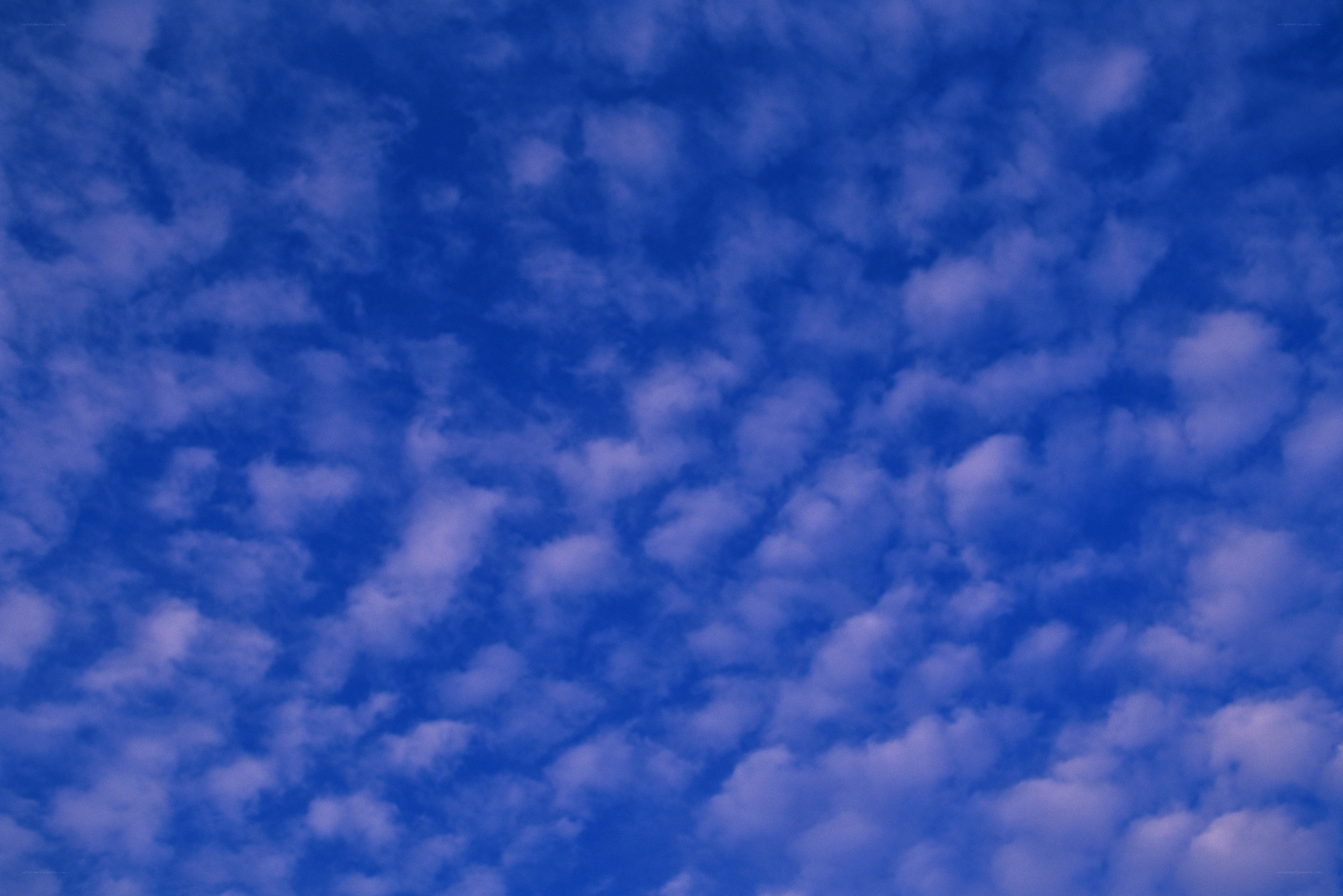 blue sky with scattered clouds