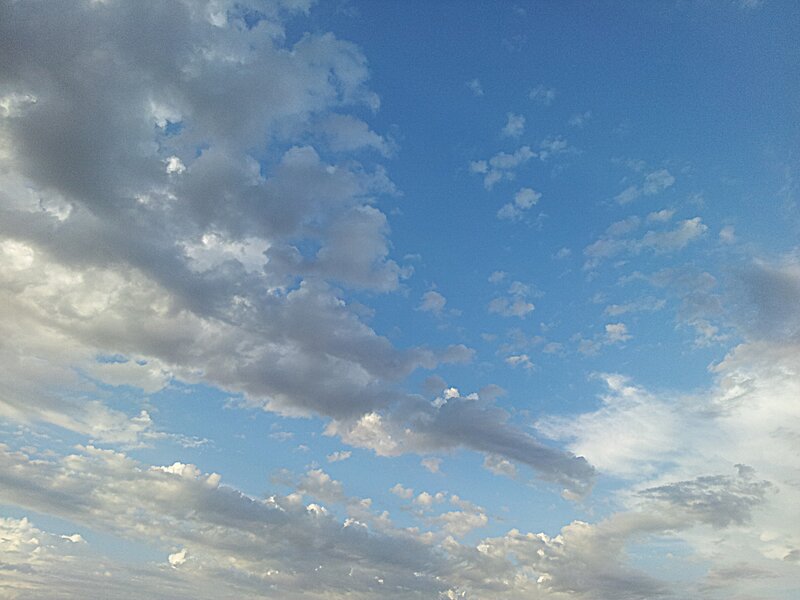 Blue sky with scattered clouds