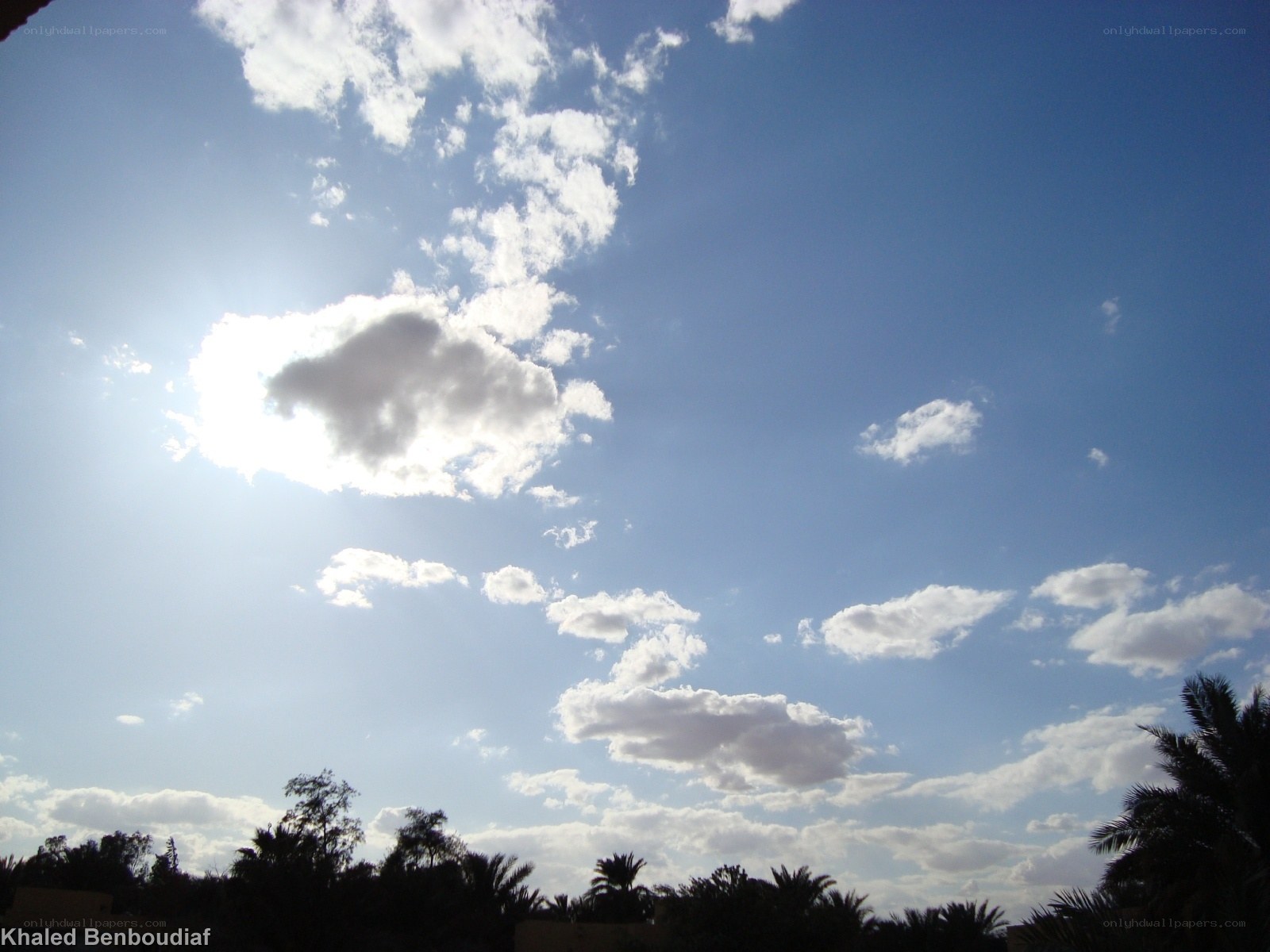 blue sky with scattered clouds
