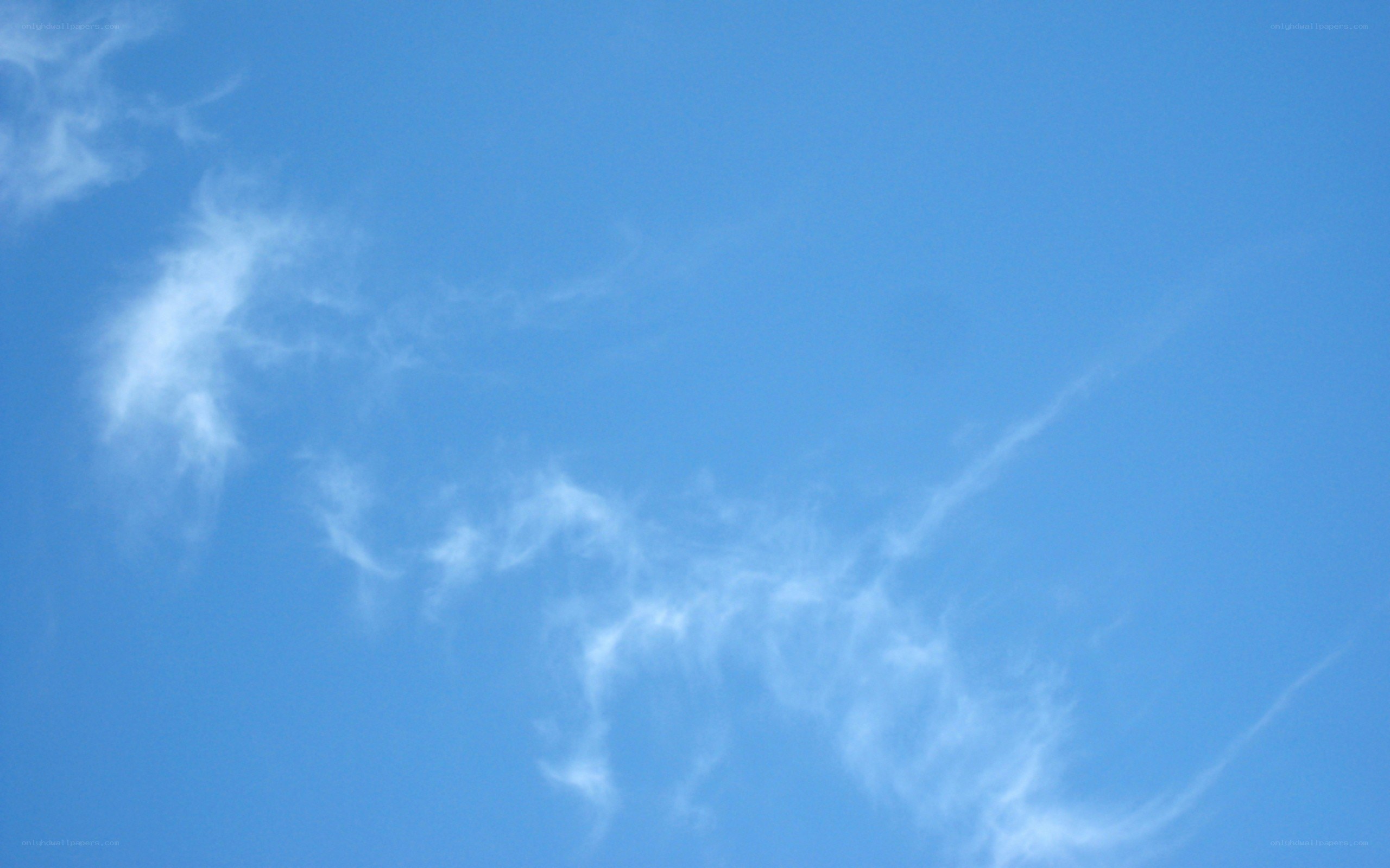blue sky with wispy clouds