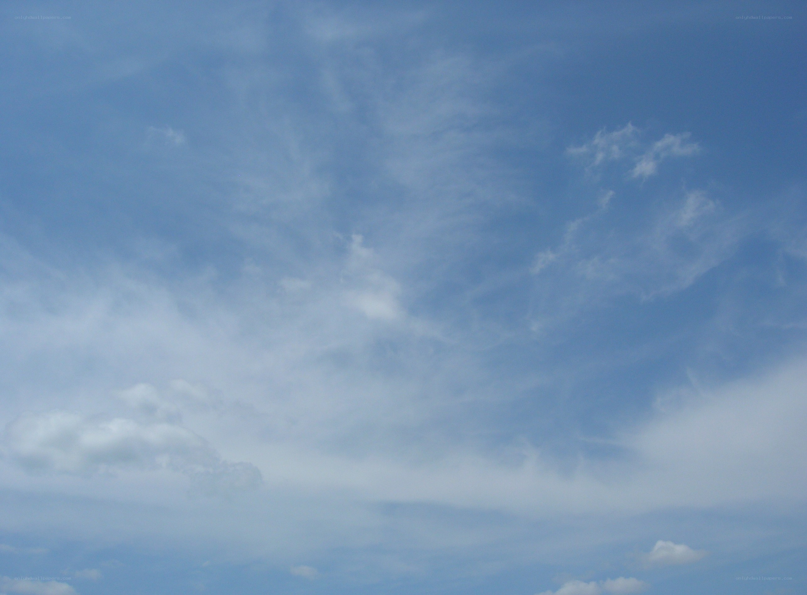 blue sky with wispy clouds