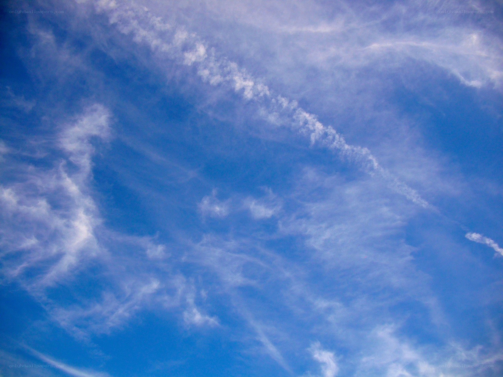 blue sky with wispy clouds
