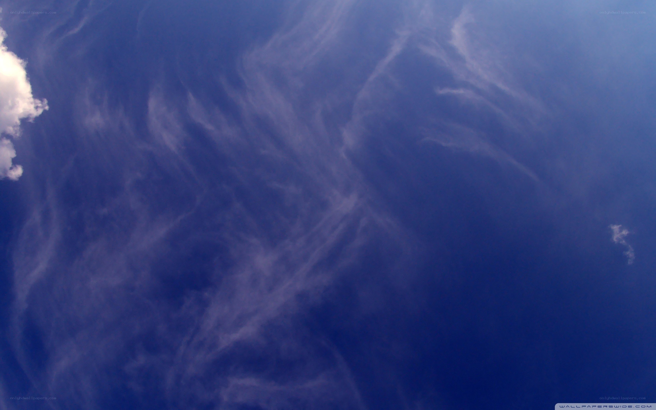 blue sky with wispy clouds