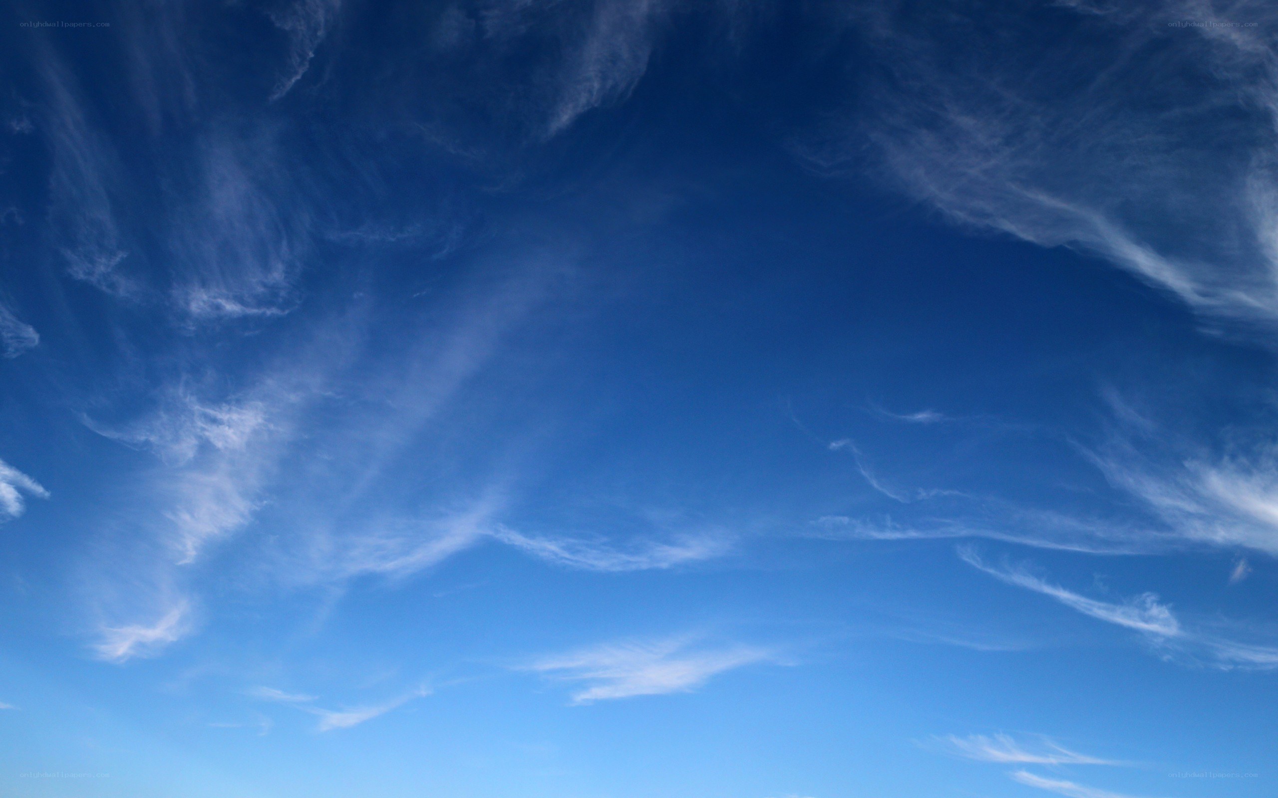 Blue sky with wispy clouds