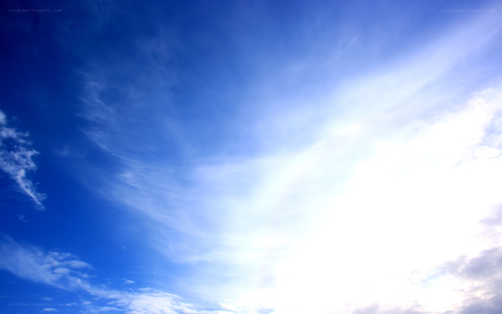 Blue sky with wispy clouds