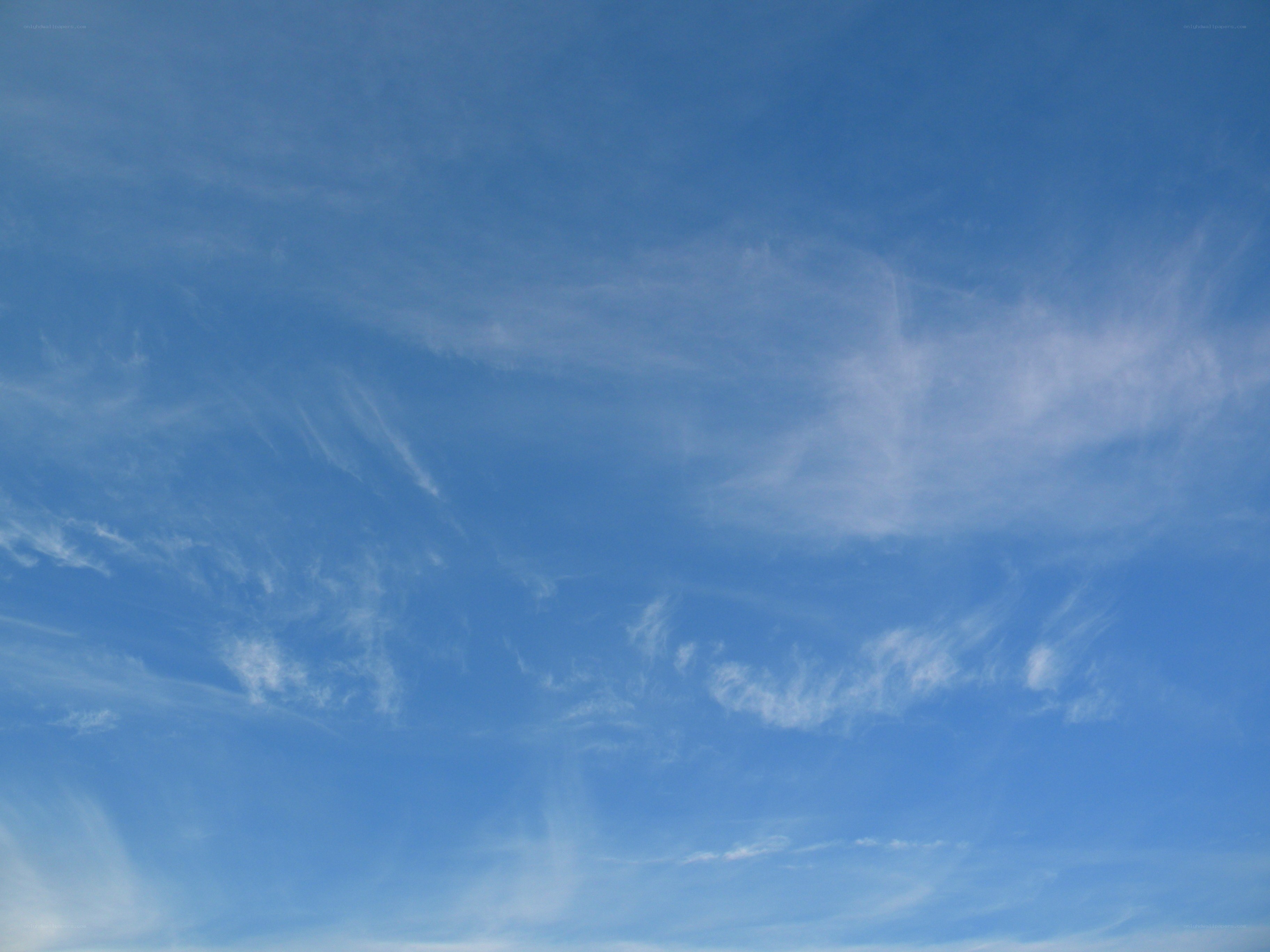 Blue sky with wispy clouds