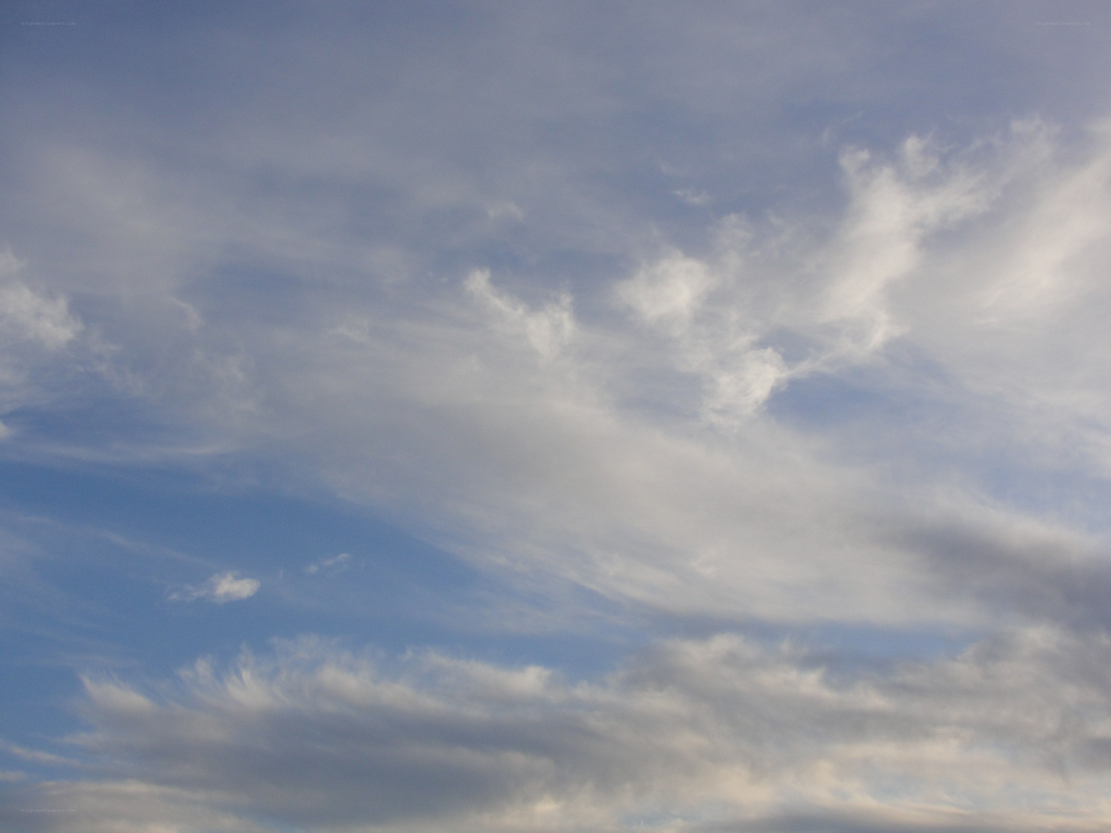 blue sky with wispy clouds