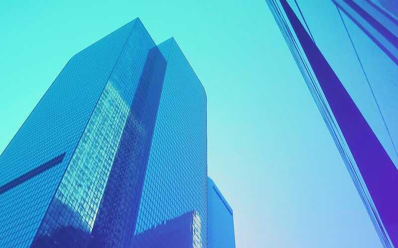 blue skyscraper under clear sky