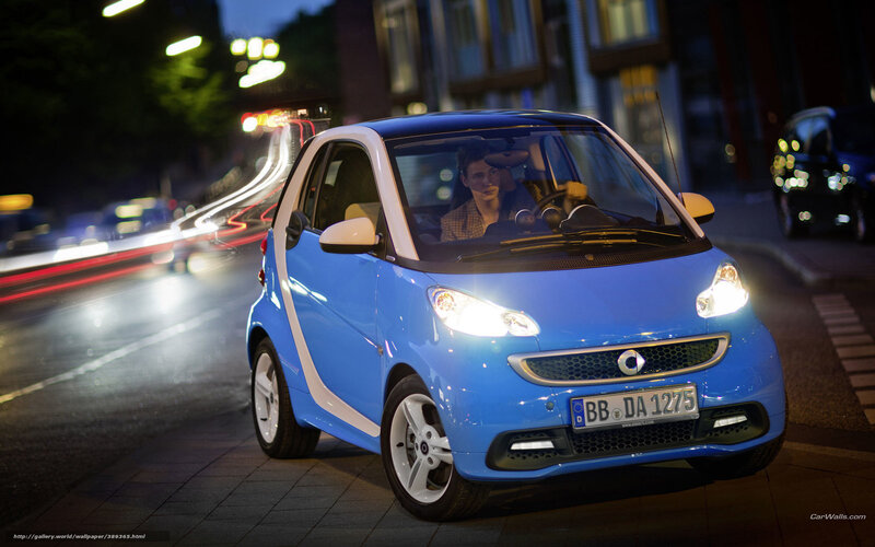 Blue smart car at night