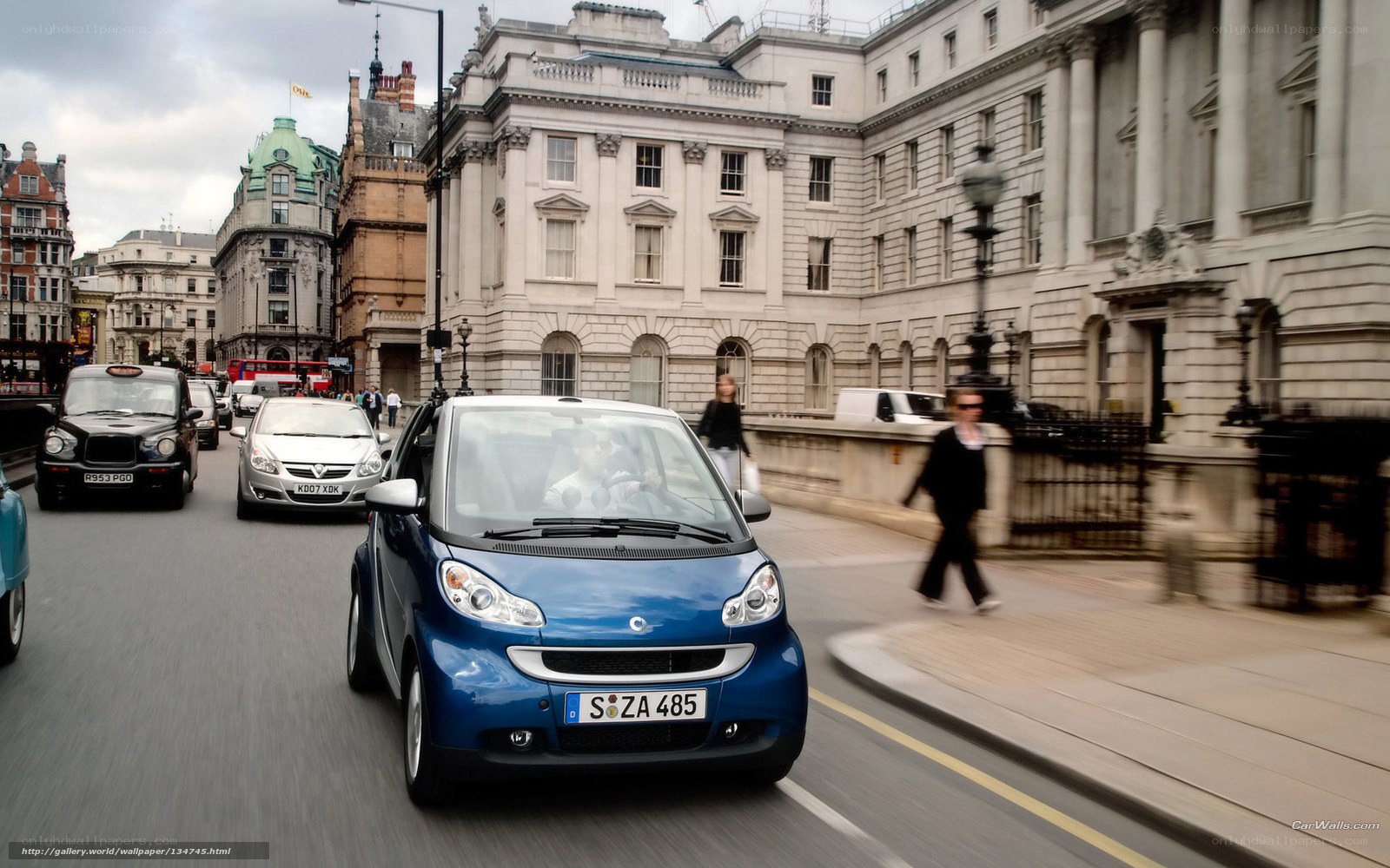 Blue smart car in London traffic