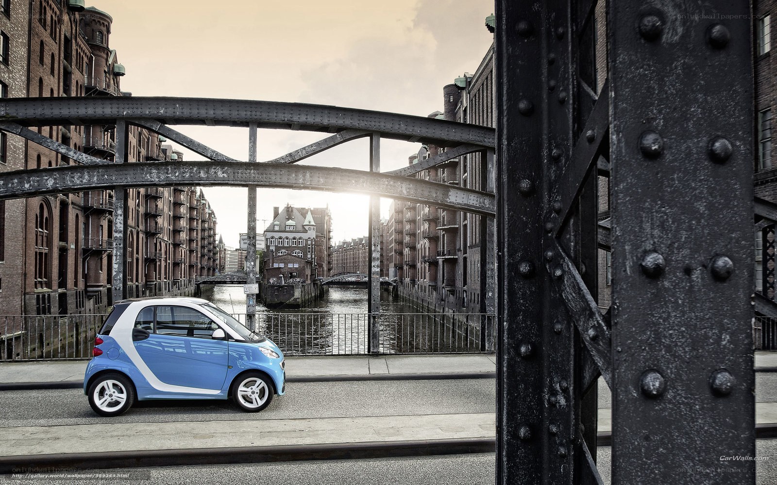 Blue smart car on a bridge