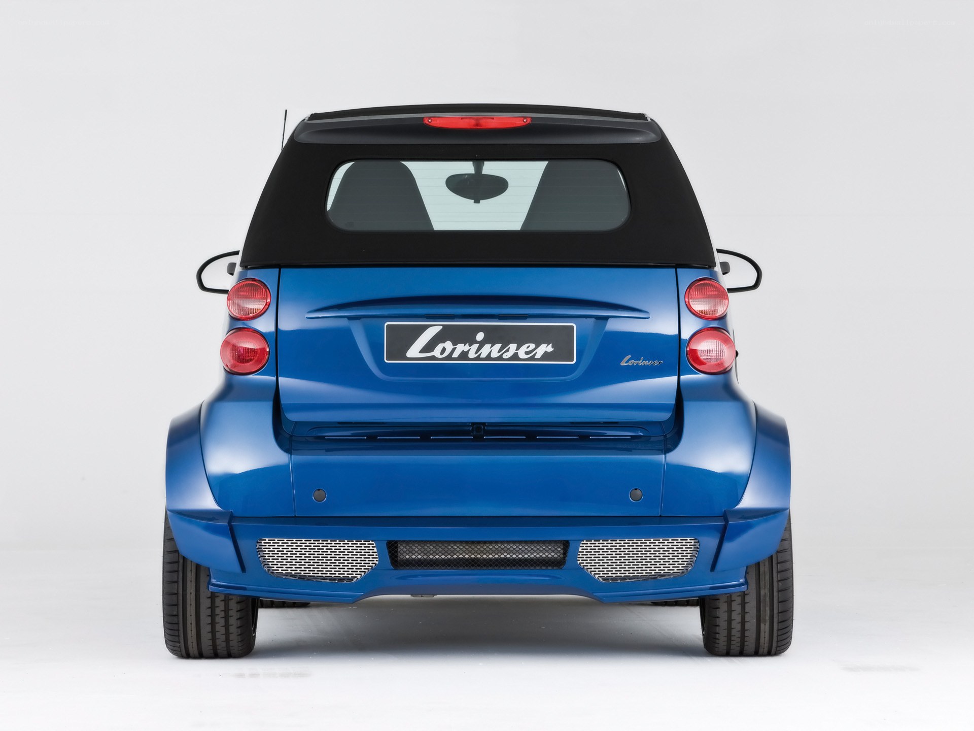 blue smart car rear view