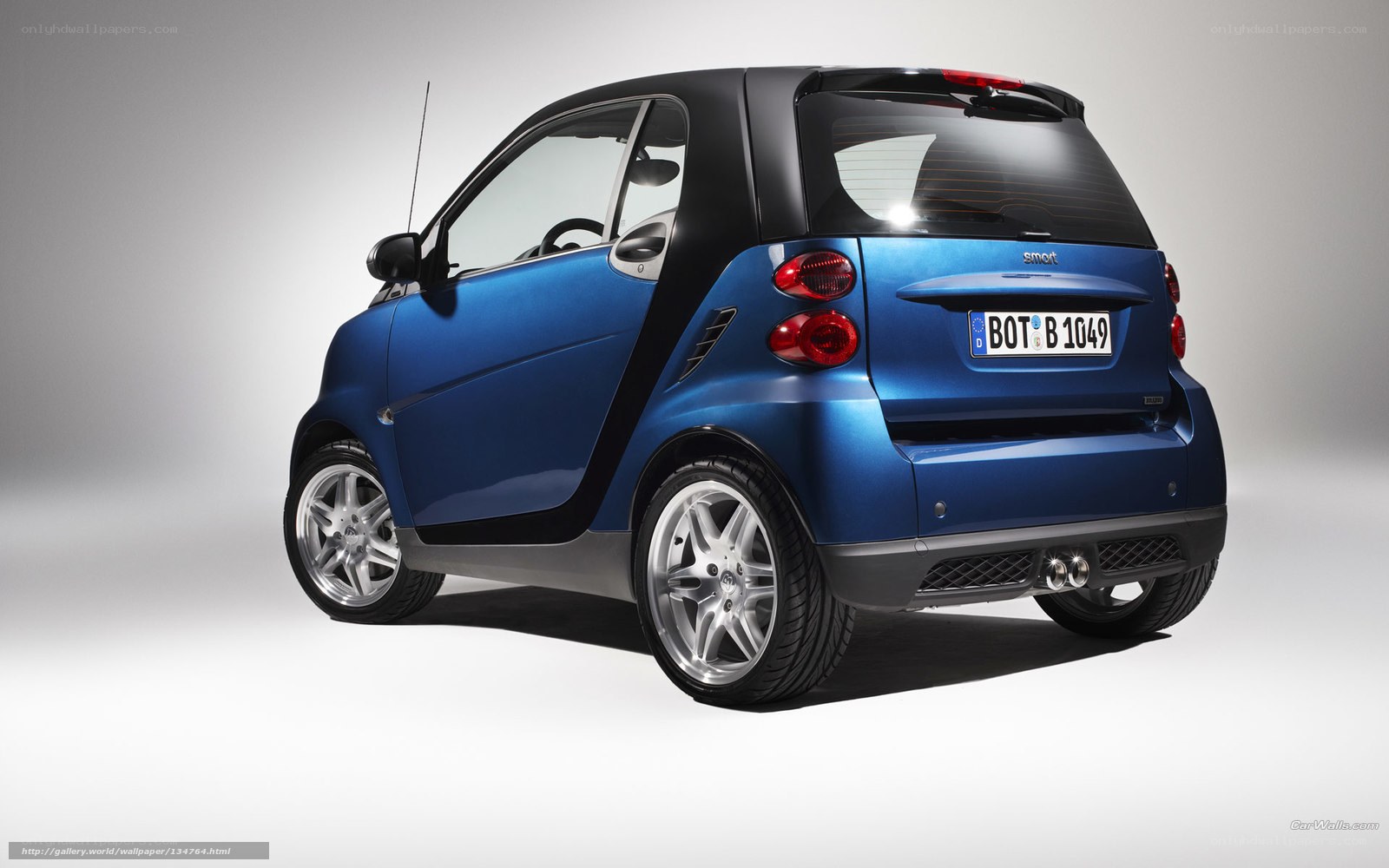 blue smart car rear view