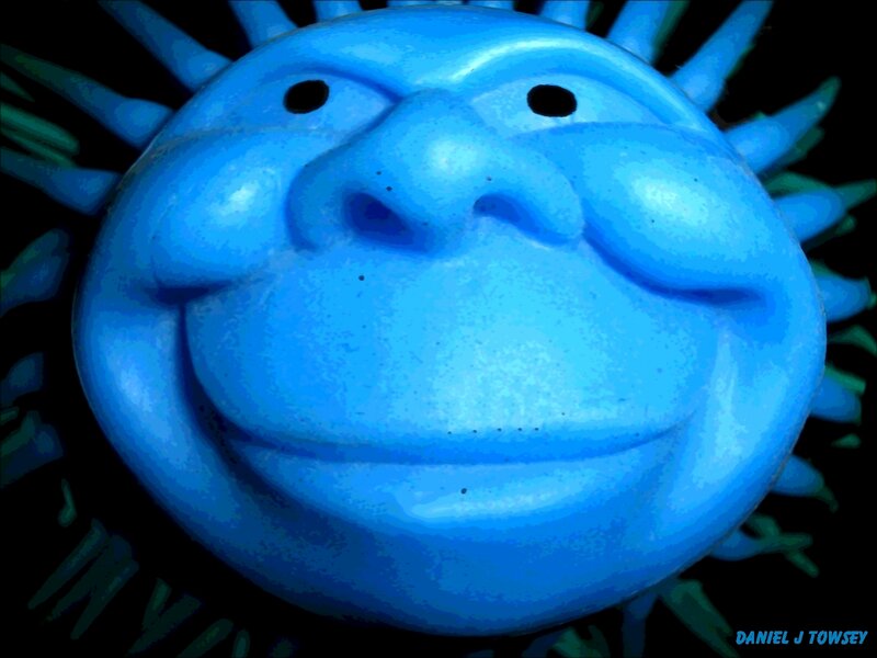 blue smiling sun sculpture