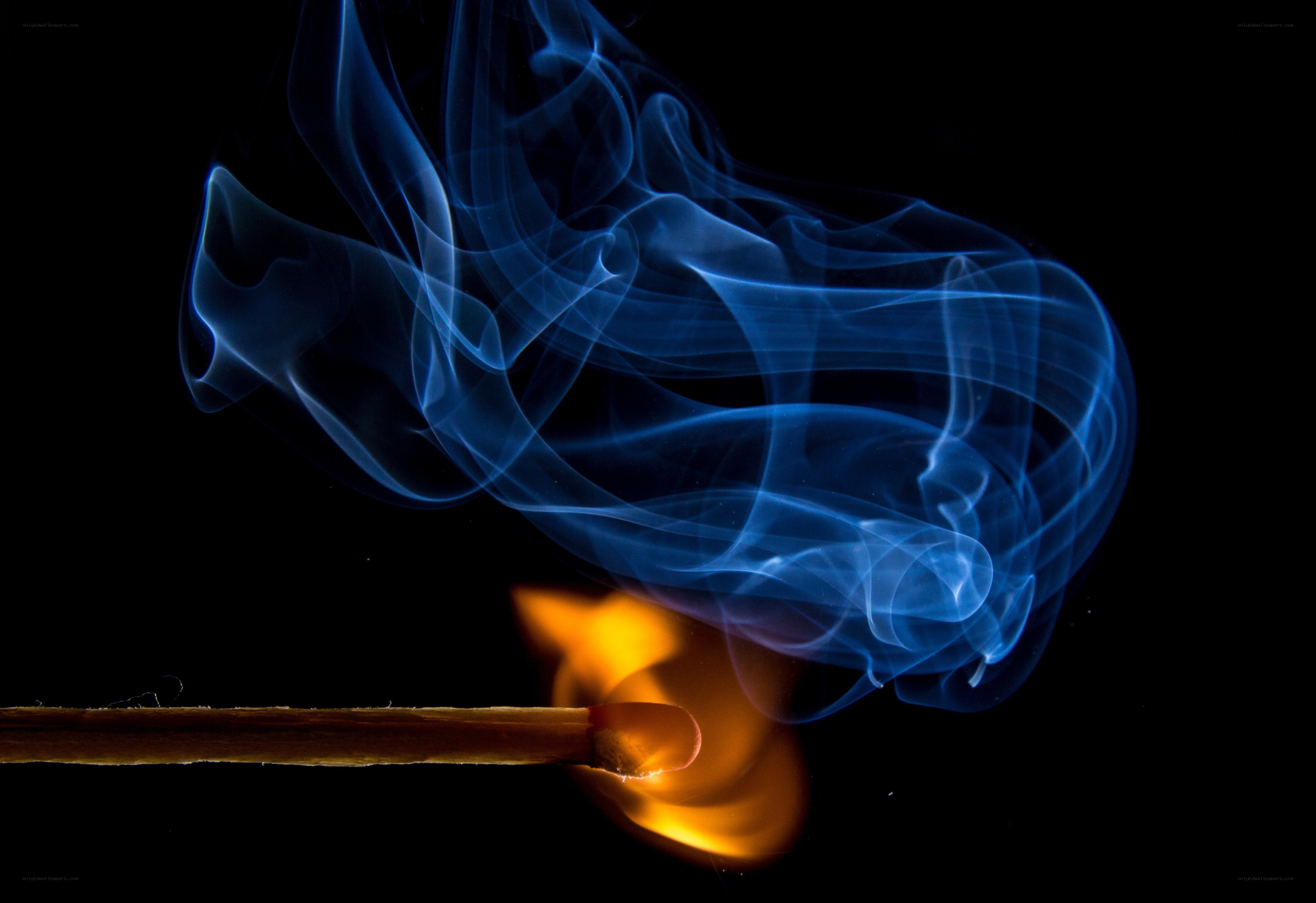 Blue smoke from a lit match