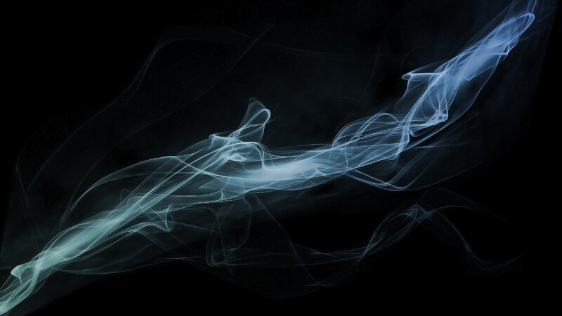blue smoke swirls on black