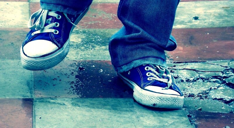 Blue Sneakers on Pavement — Moody