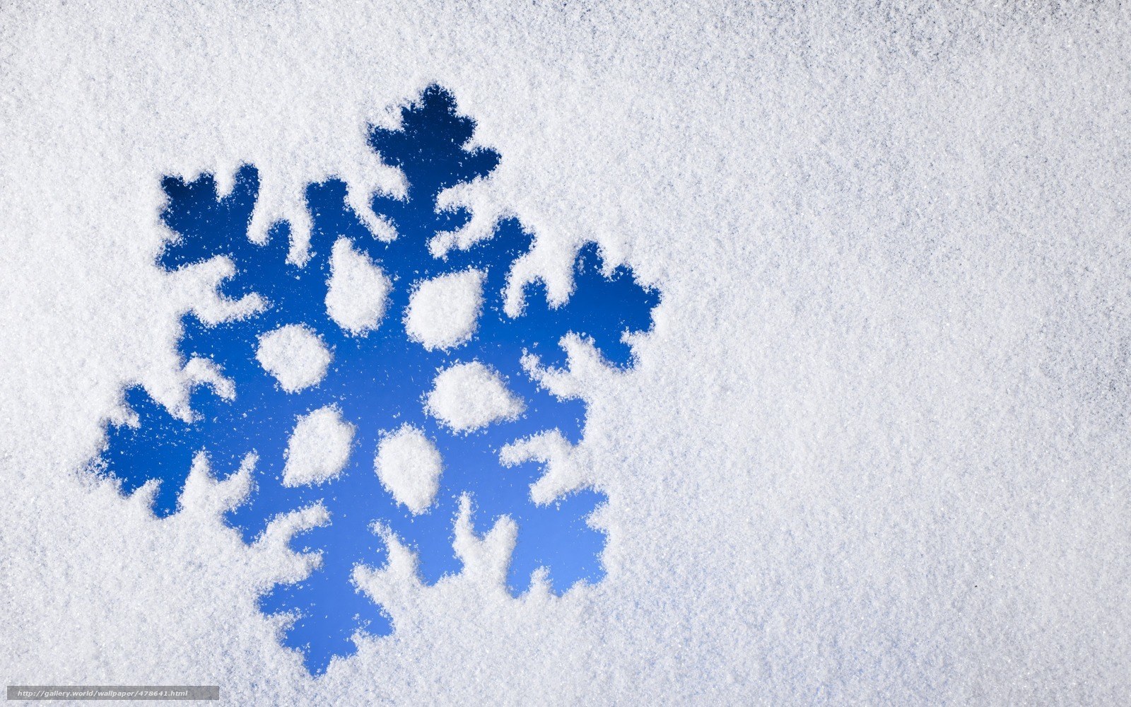 blue snowflake in the snow
