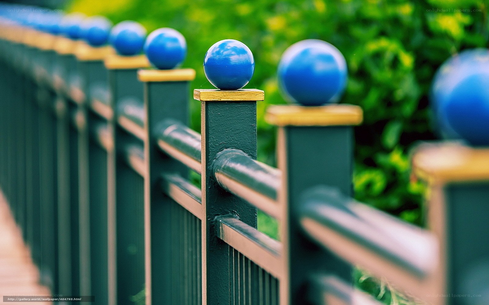 blue spheres on fence posts