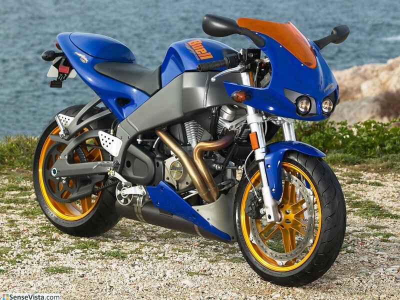 blue sport motorcycle by the sea