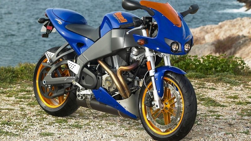 blue sport motorcycle by the sea