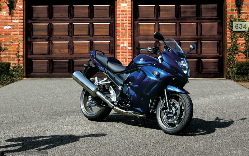 blue sport motorcycle in driveway