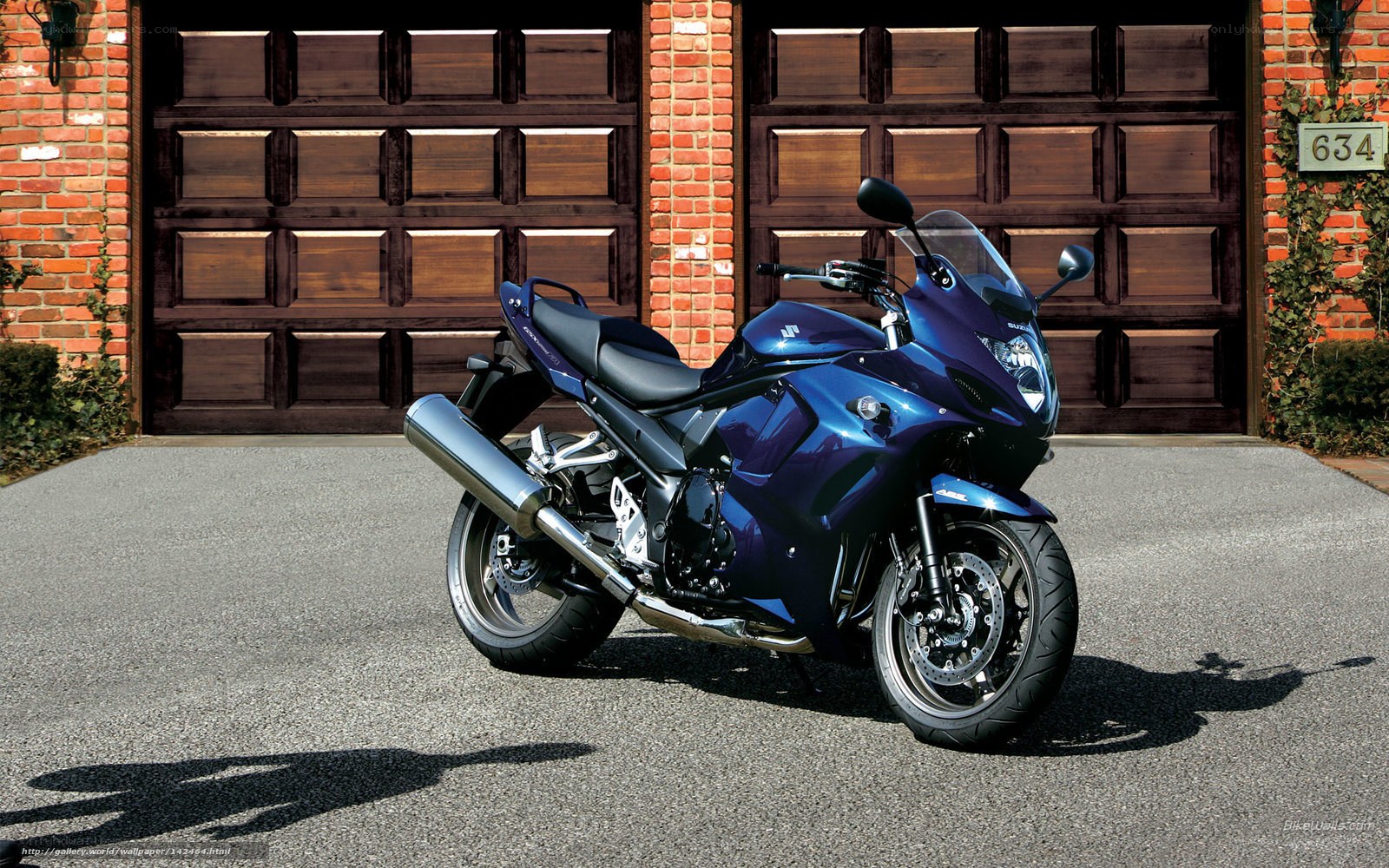 blue sport motorcycle in driveway