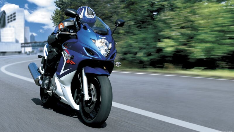 blue sport motorcycle on road