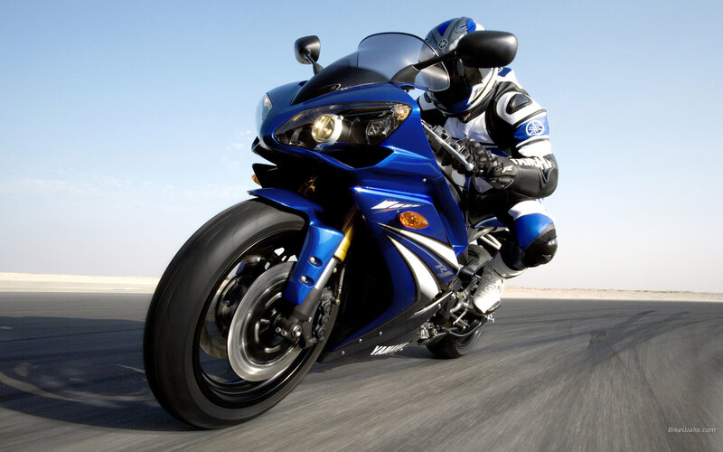 blue sport motorcycle on track