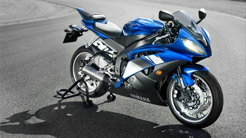 blue sport motorcycle on track
