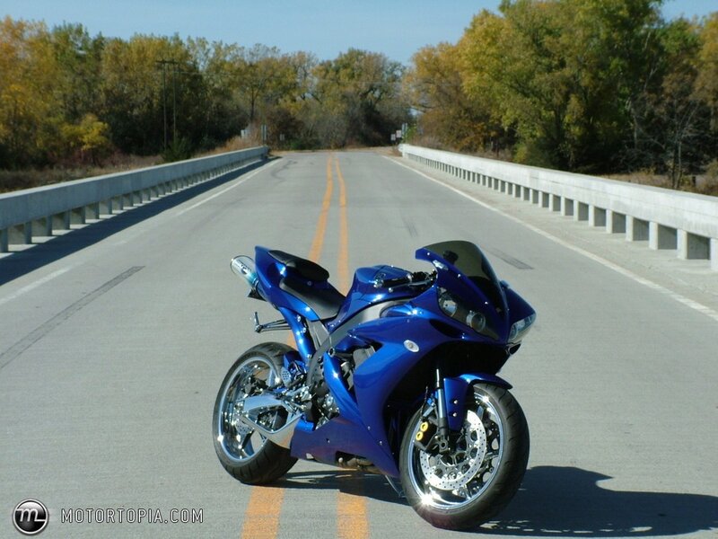 Blue sportbike on a bridge