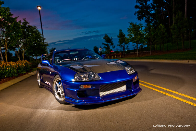blue sports car at dusk