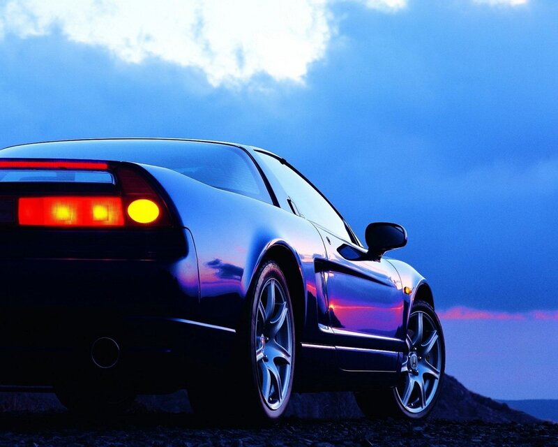 Blue sports car at dusk