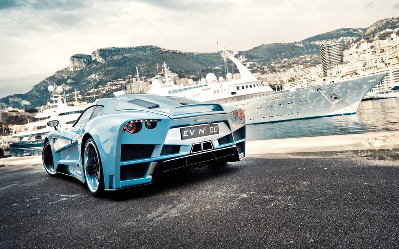 blue sports car at marina