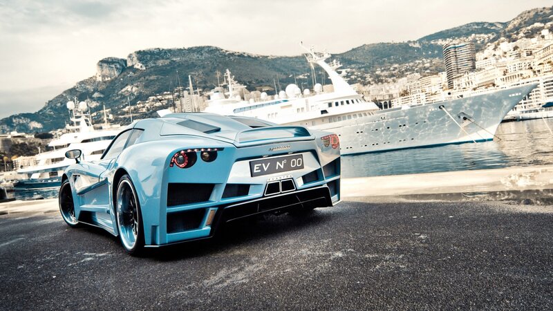 blue sports car at marina