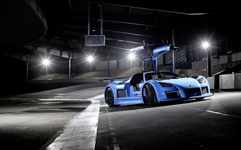blue sports car at night