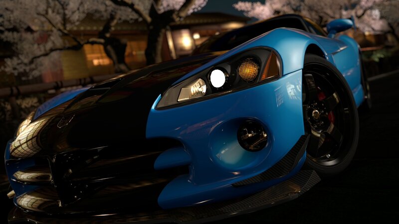 Blue sports car at night