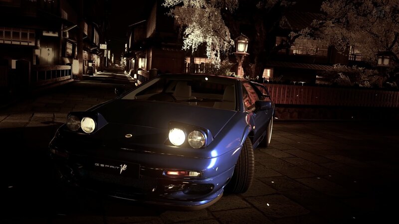 Blue sports car at night