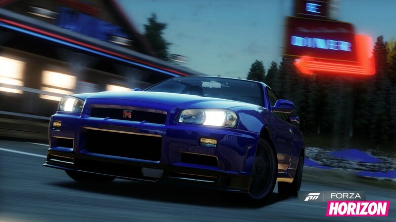 blue sports car at night