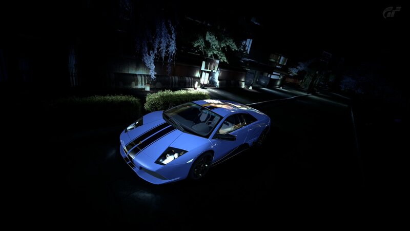 blue sports car at night