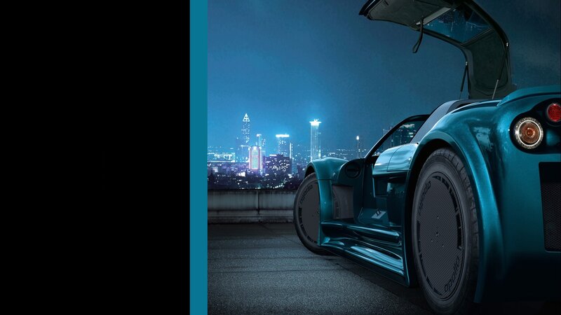 blue sports car at night