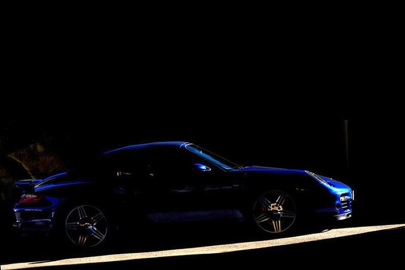 blue sports car at night