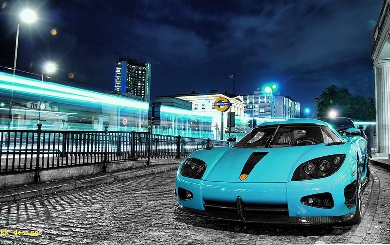 Blue sports car at night