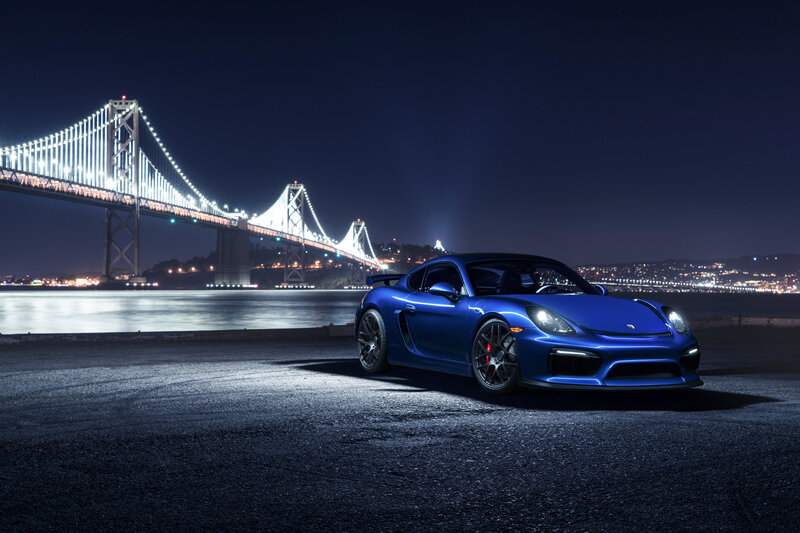Blue sports car at night