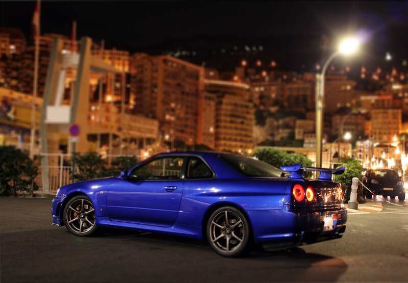 Blue sports car at night