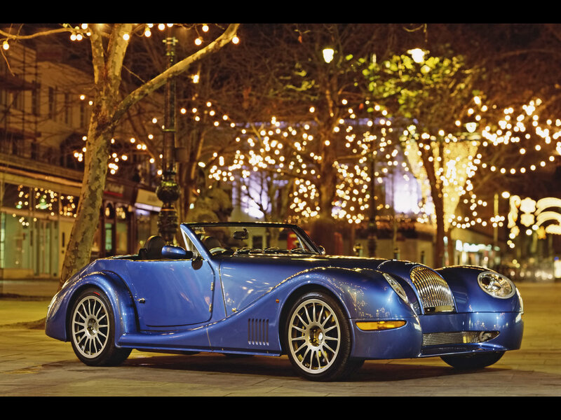 Blue sports car at night