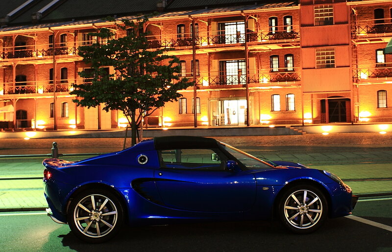 Blue sports car at night